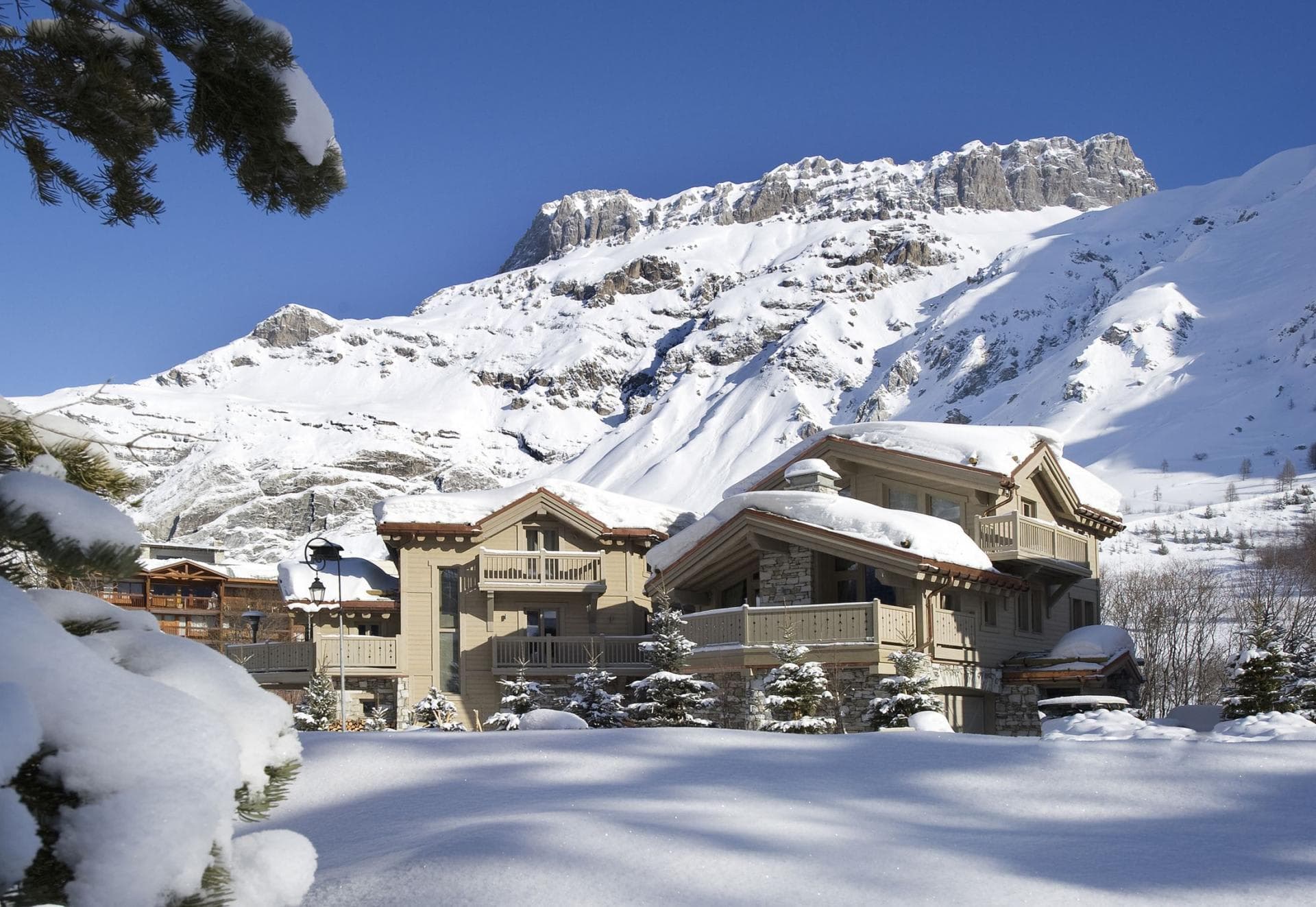 Ski-in/ski-out chalet with private balconies and mountain peak views