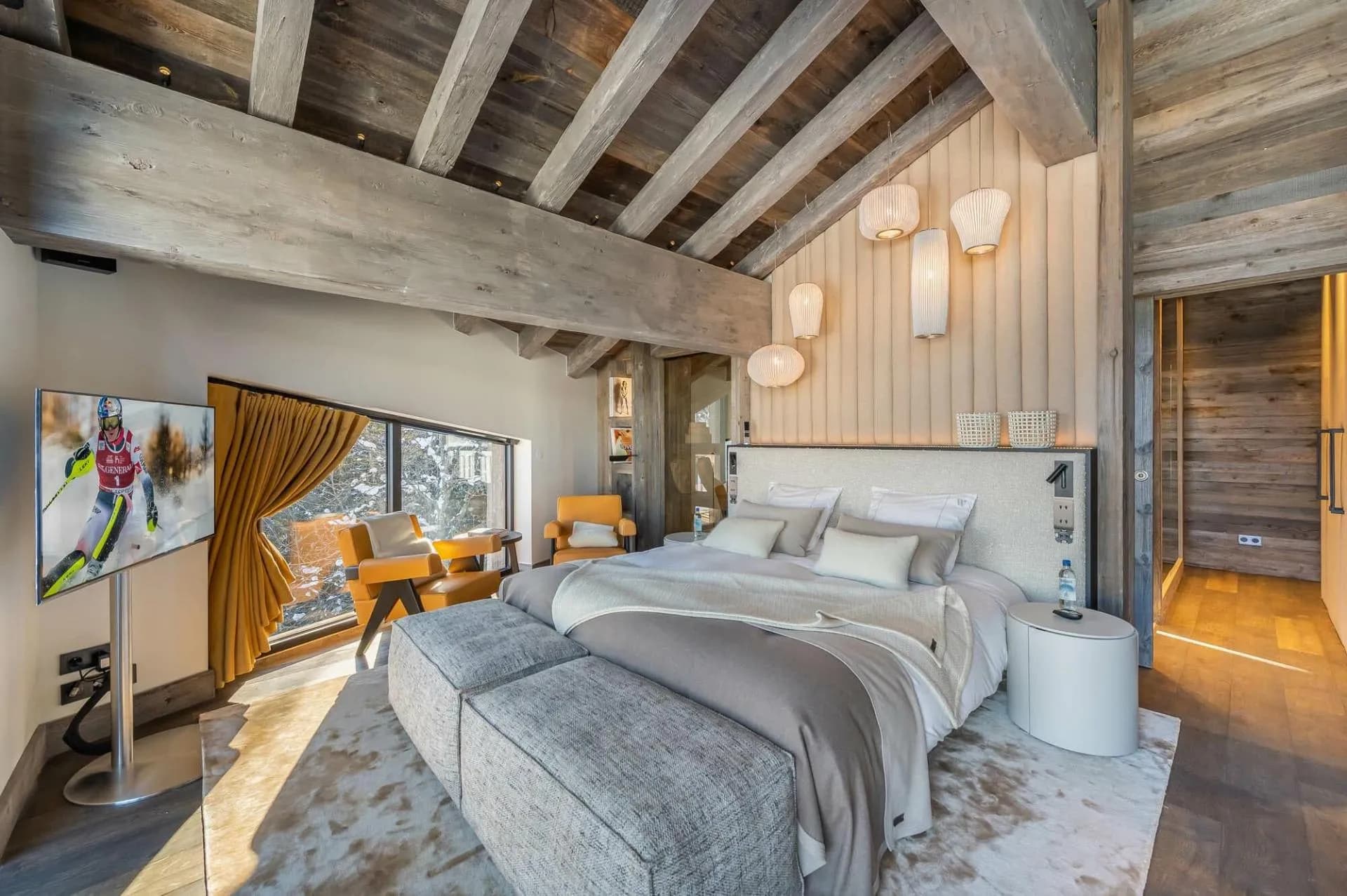 Double bedroom with exposed beams and fireplace