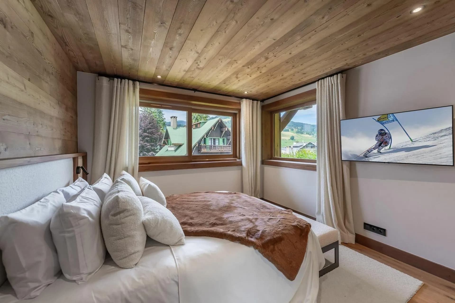 Double bedroom beside two windows