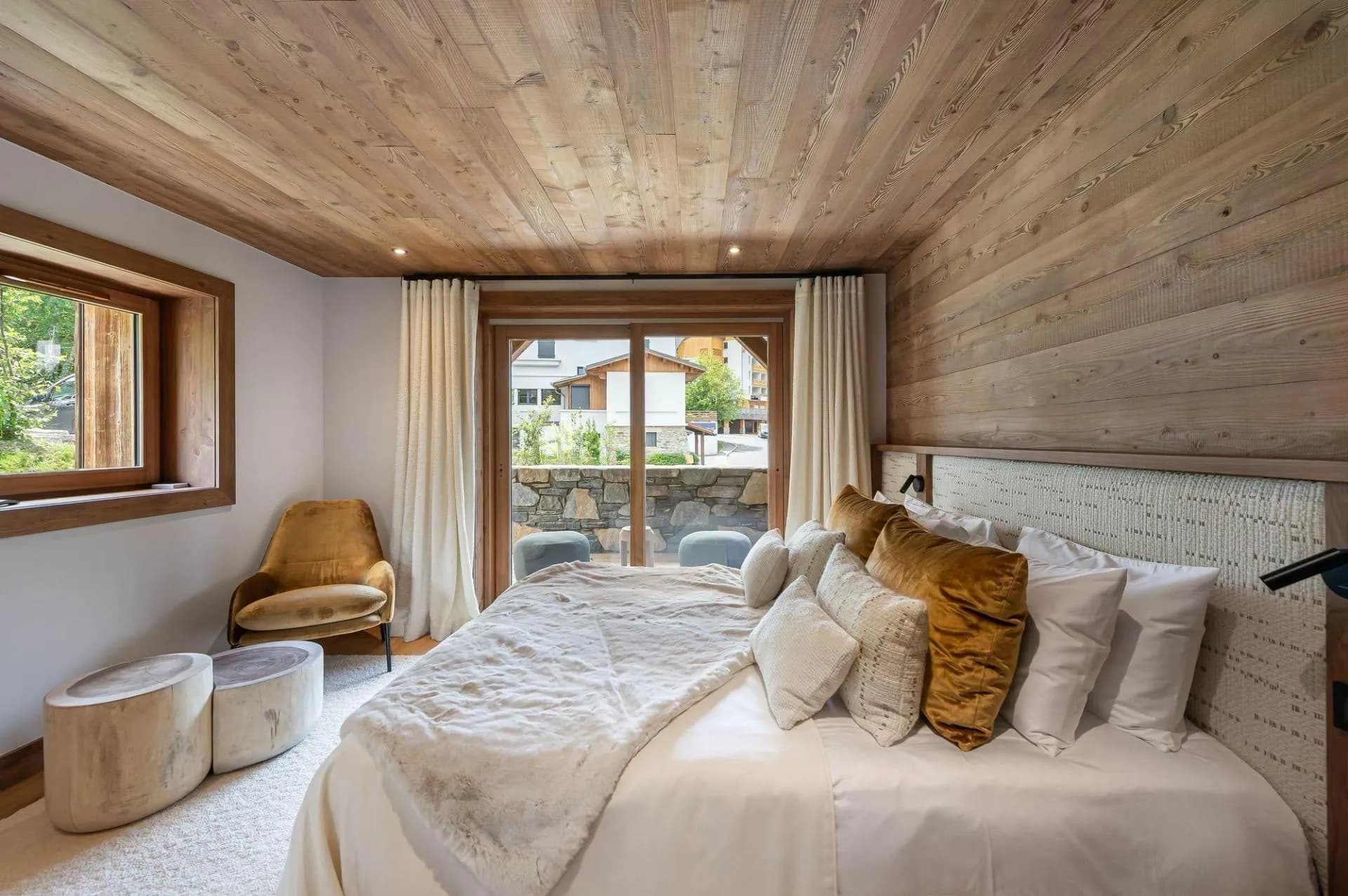 Double bedroom beside balcony doors