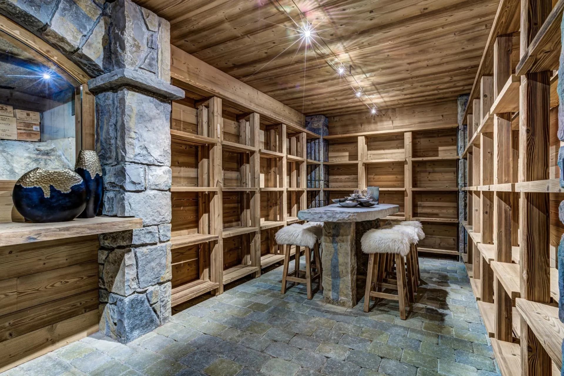 Wine cellar with stone tasting table and seating for four