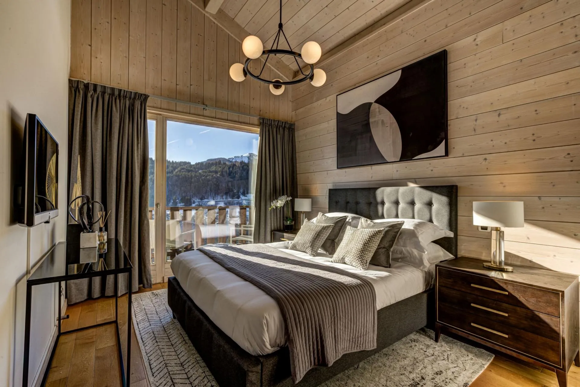Bedroom with king bed and private balcony access with mountain views