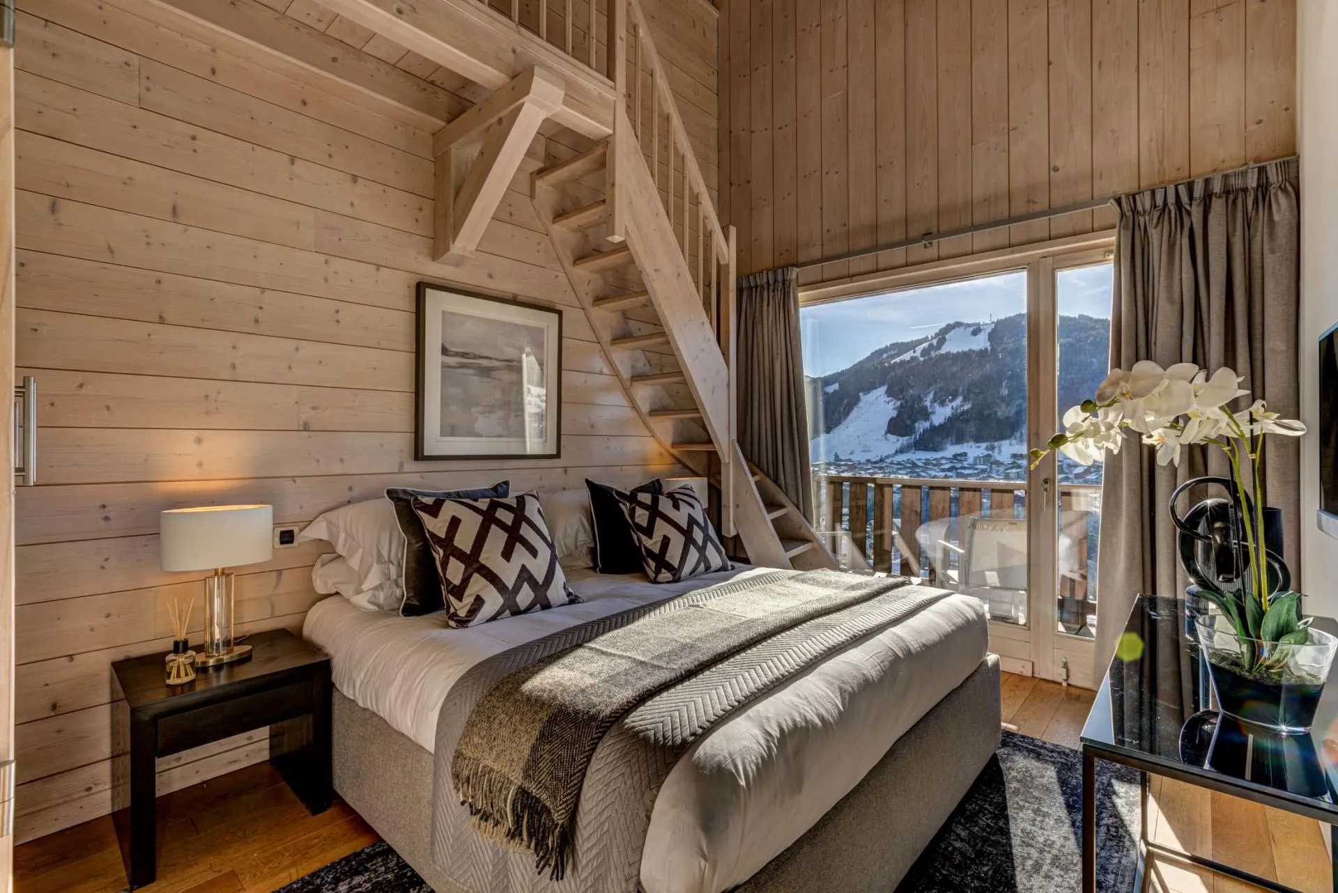 Room 4 with balcony access and stairs to its private mezzanine