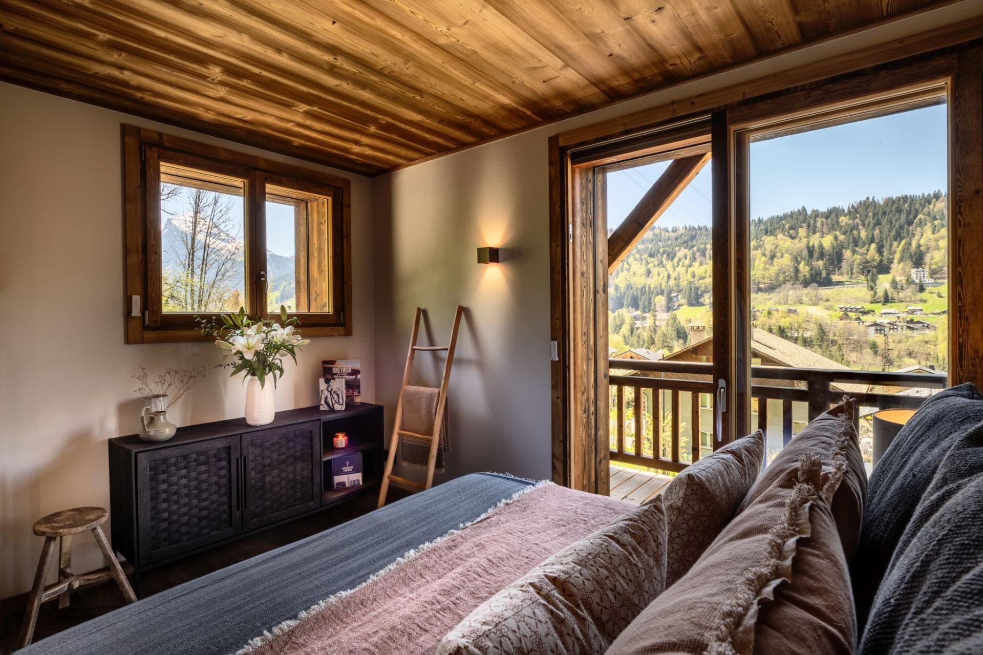 Bedroom with balcony access and mountain views