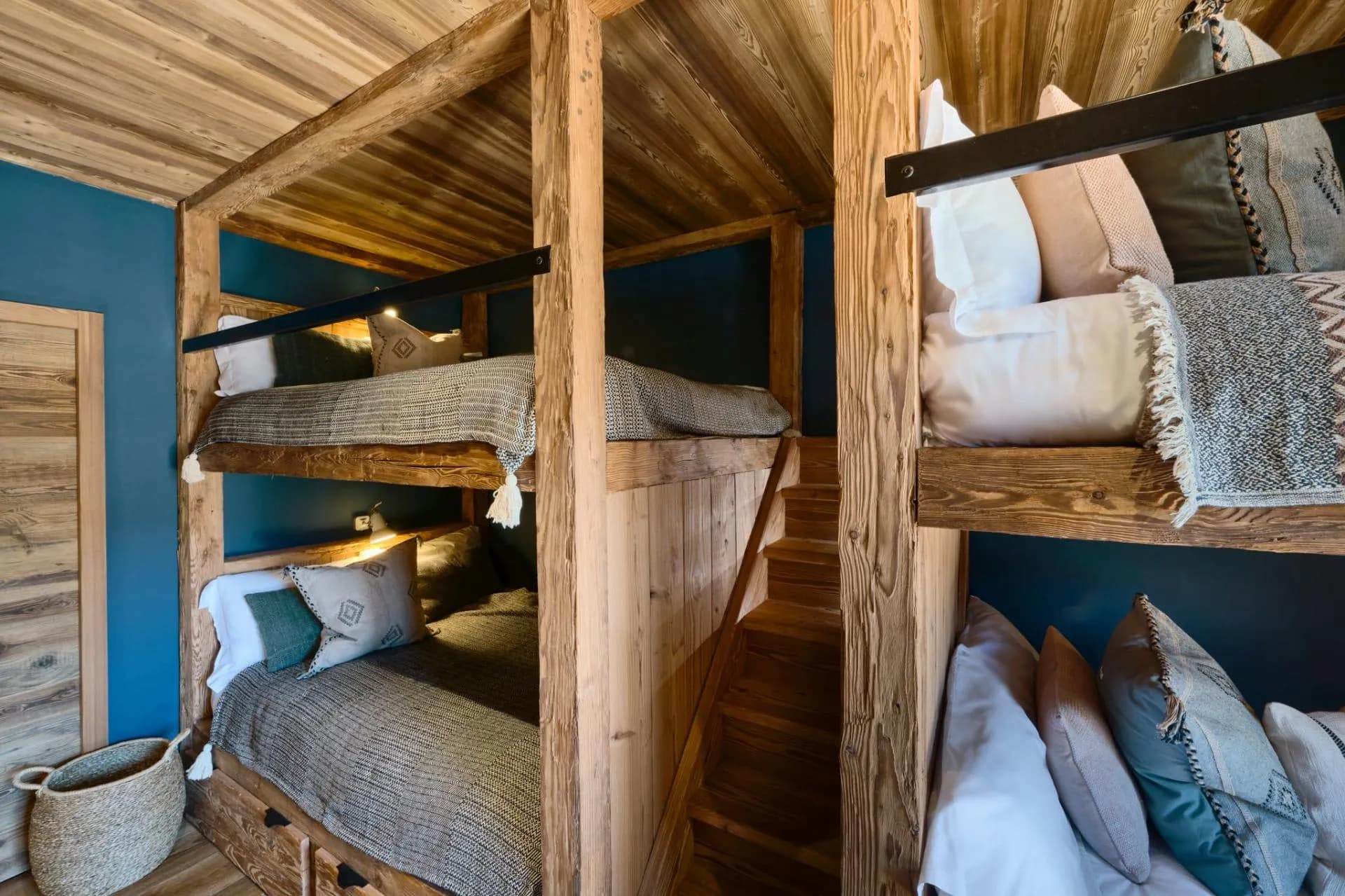 Bunk room with four double beds and built-in stairs