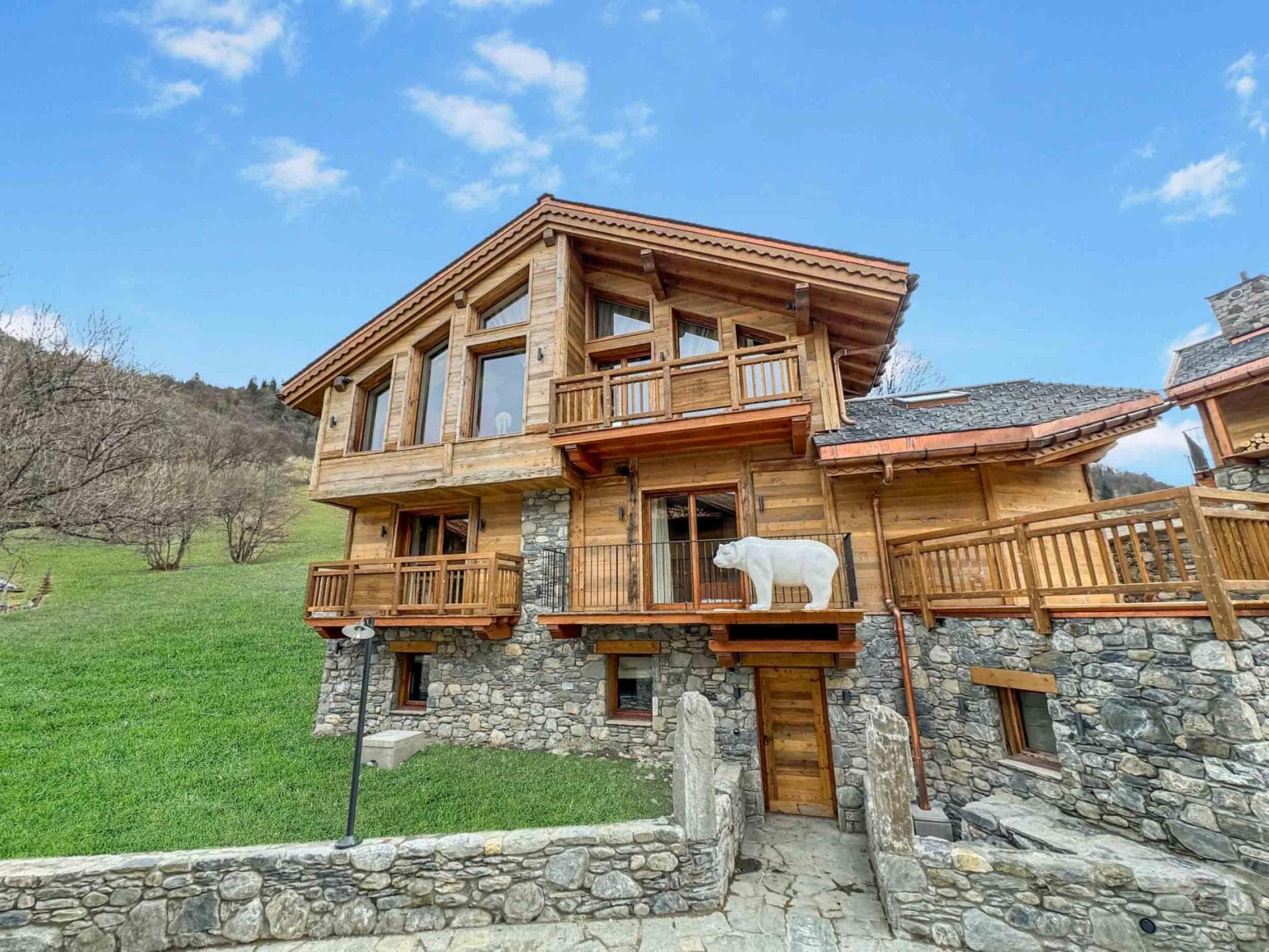 Stone and timber chalet with three levels of private balconies
