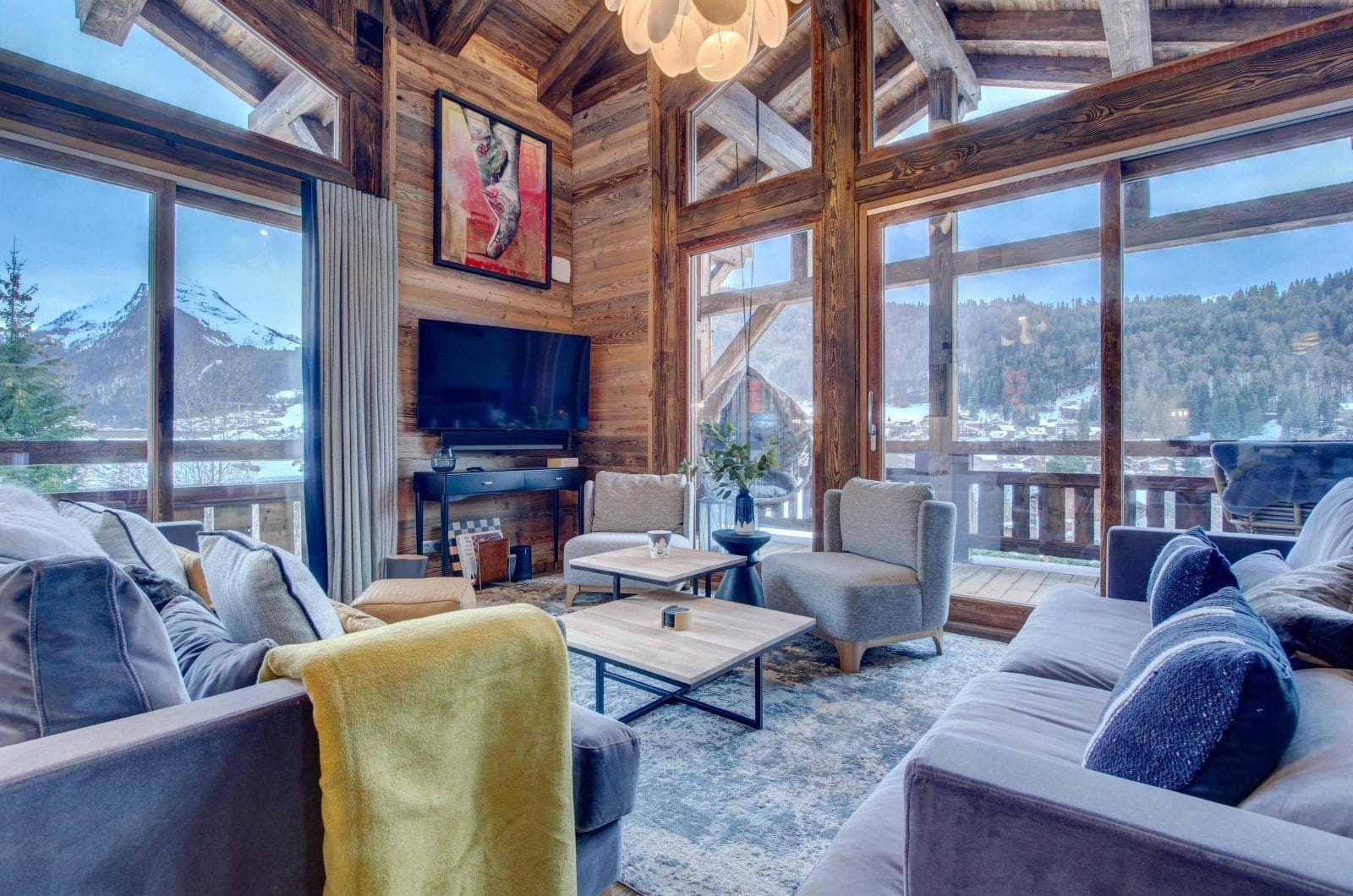 Living room with vaulted timber ceilings and panoramic mountain views