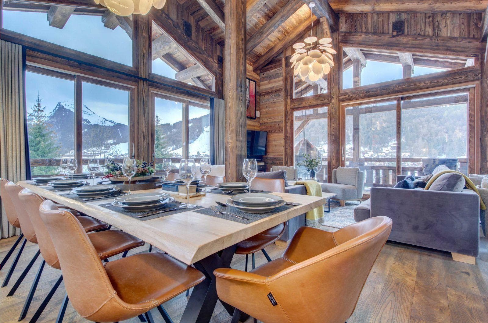 Dining table seats 10 with floor-to-ceiling mountain views