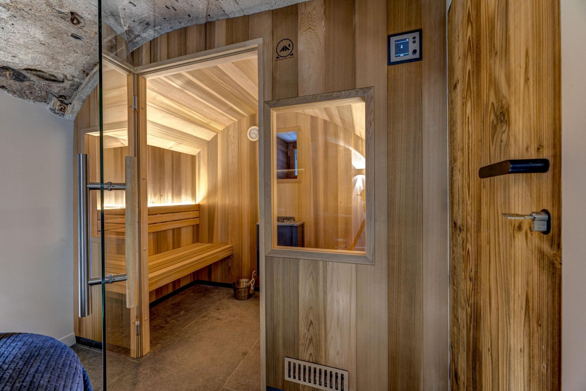 Cedar sauna with digital controls and two-tier seating