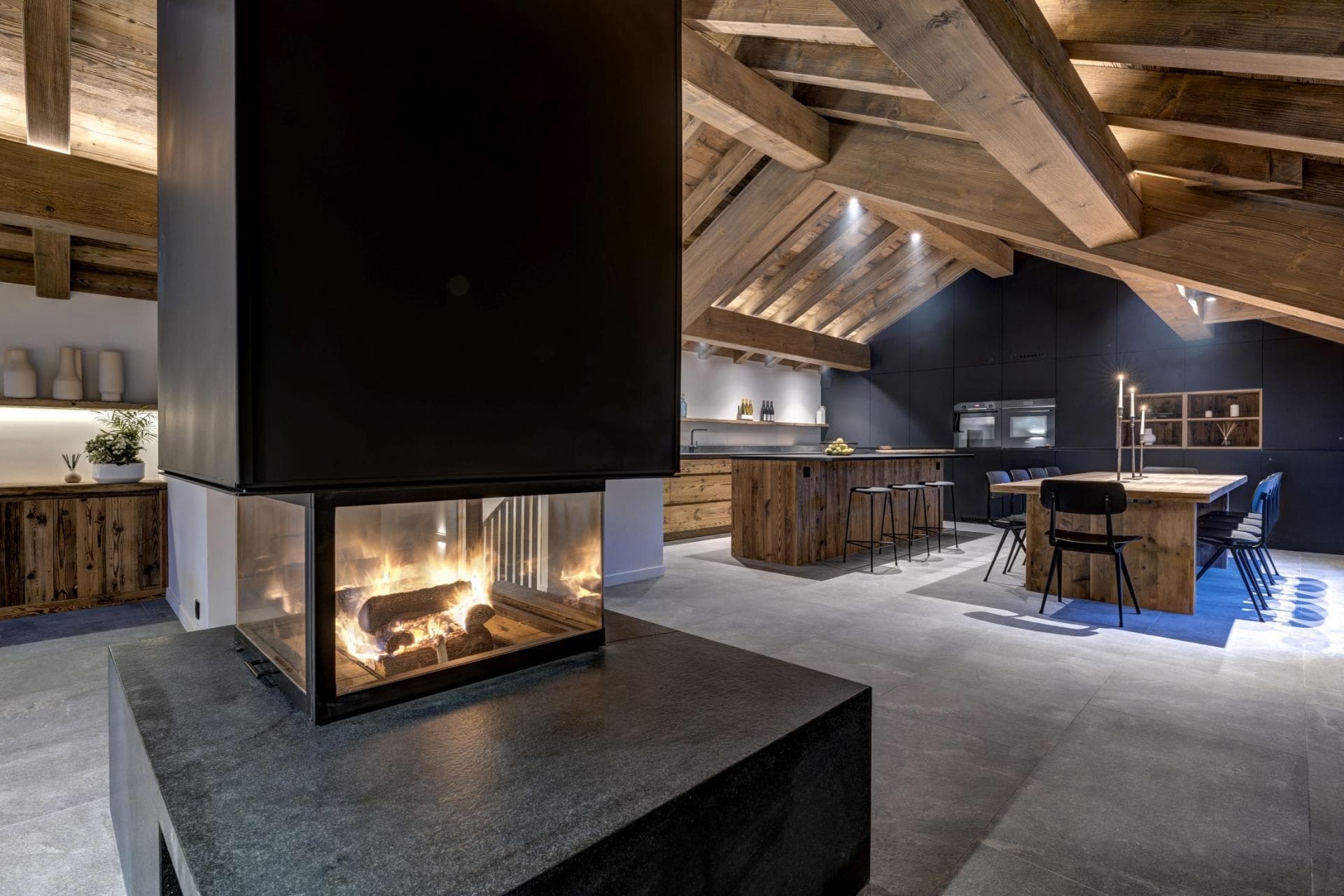 Three-sided wood fireplace; open kitchen with island seating for 4