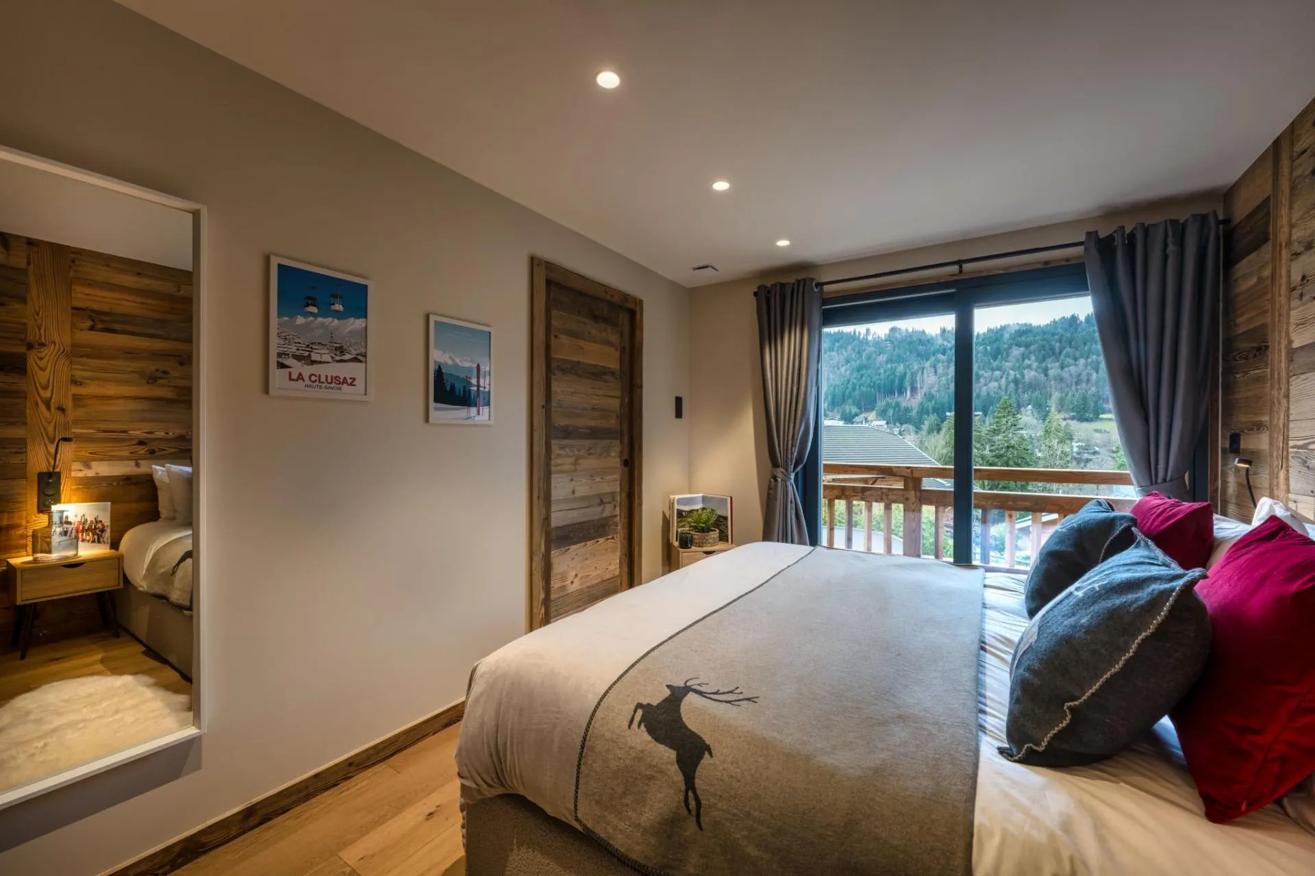 Bedroom with balcony access and timber finishes