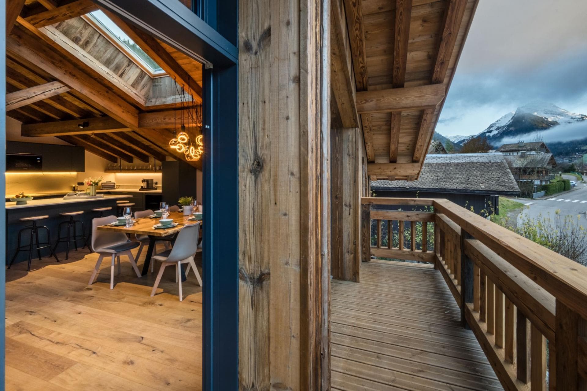 Covered balcony overlooking dining area with views of Mont Blanc