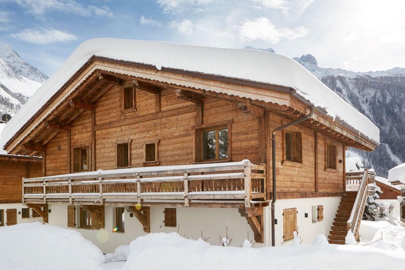 Timber chalet with wraparound balcony and mountain views