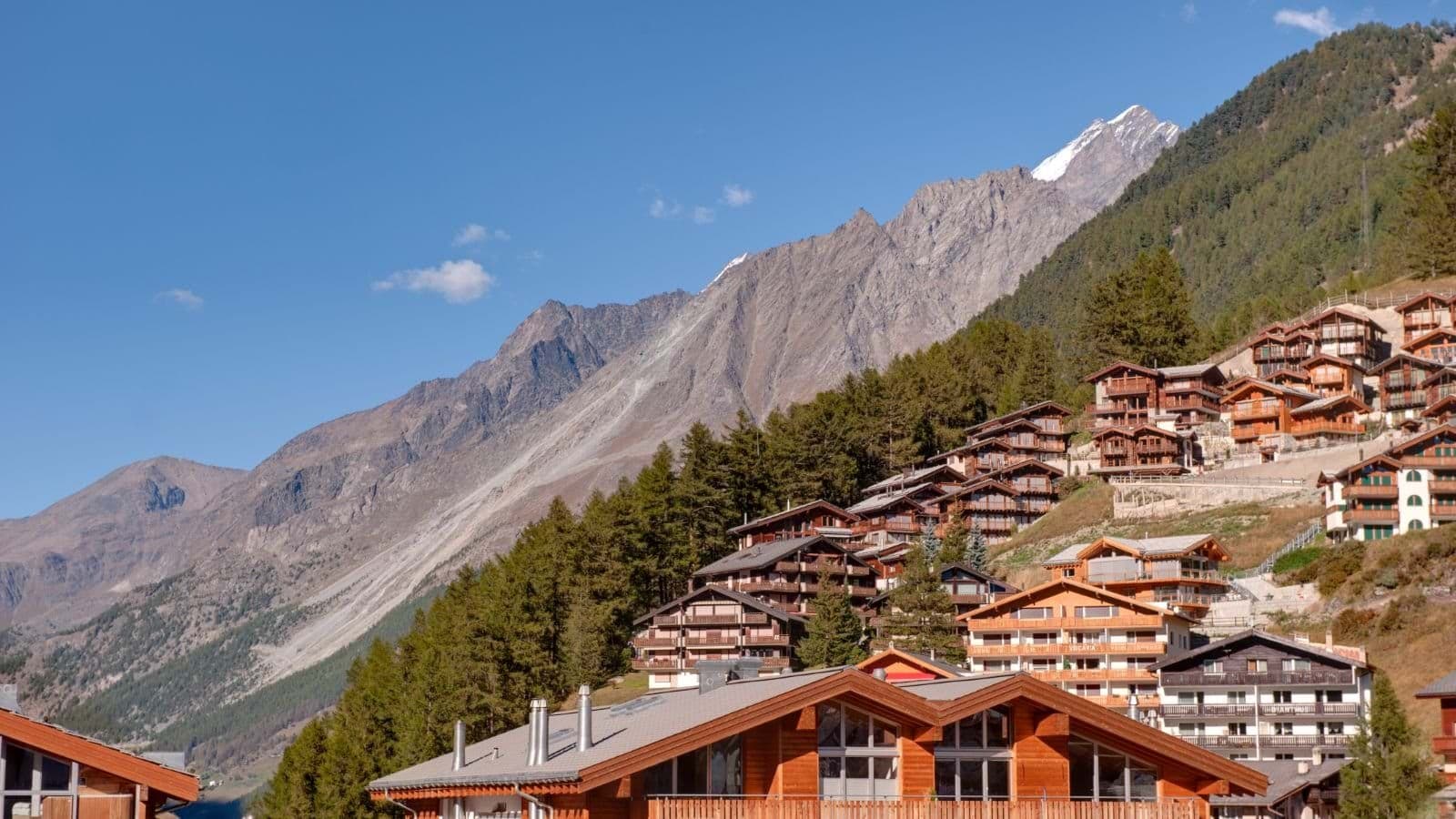 Alpine village setting with views of snow-capped mountain peaks