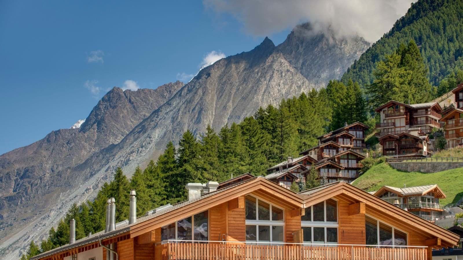 Chalet exterior with mountain views and private balcony