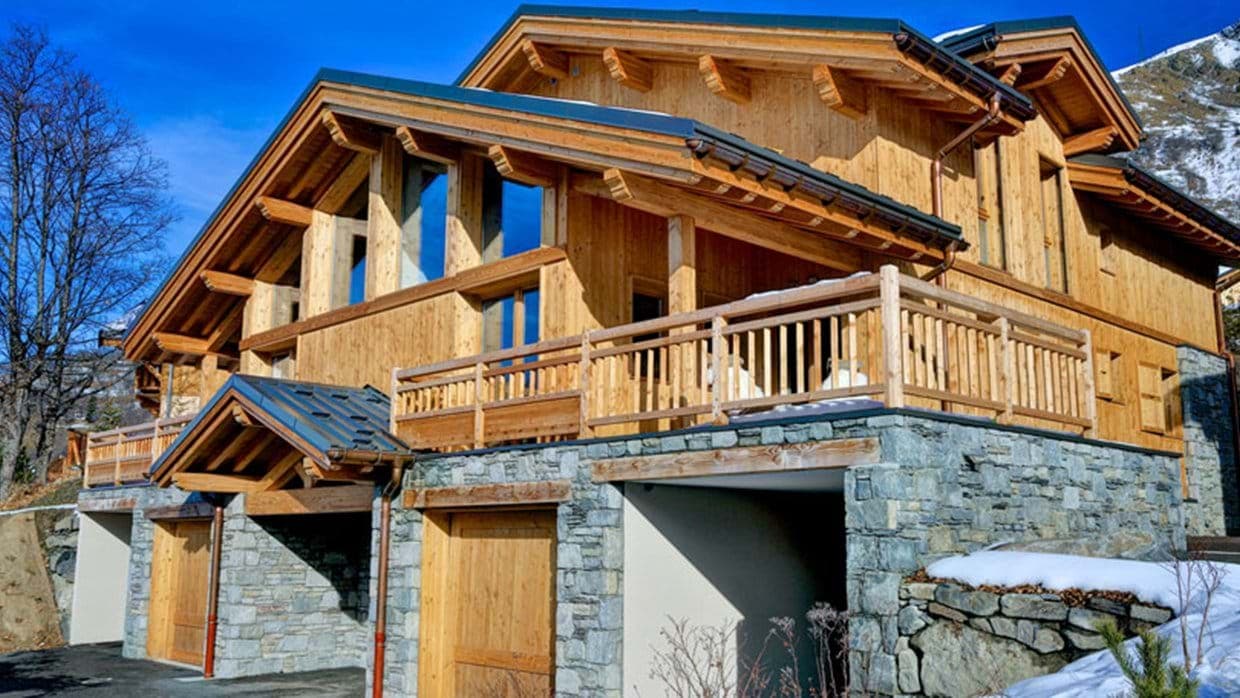 Timber and stone chalet with double garage and wrap-around balcony