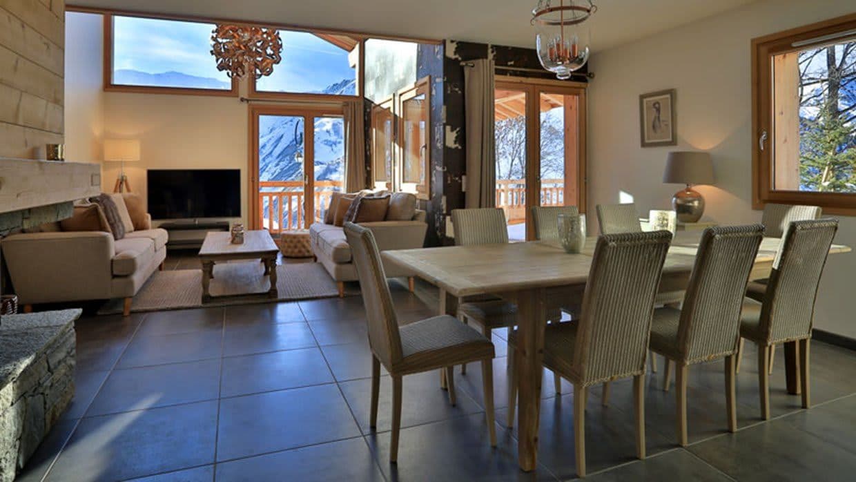 Living and dining area; dining table seats 8 with mountain views