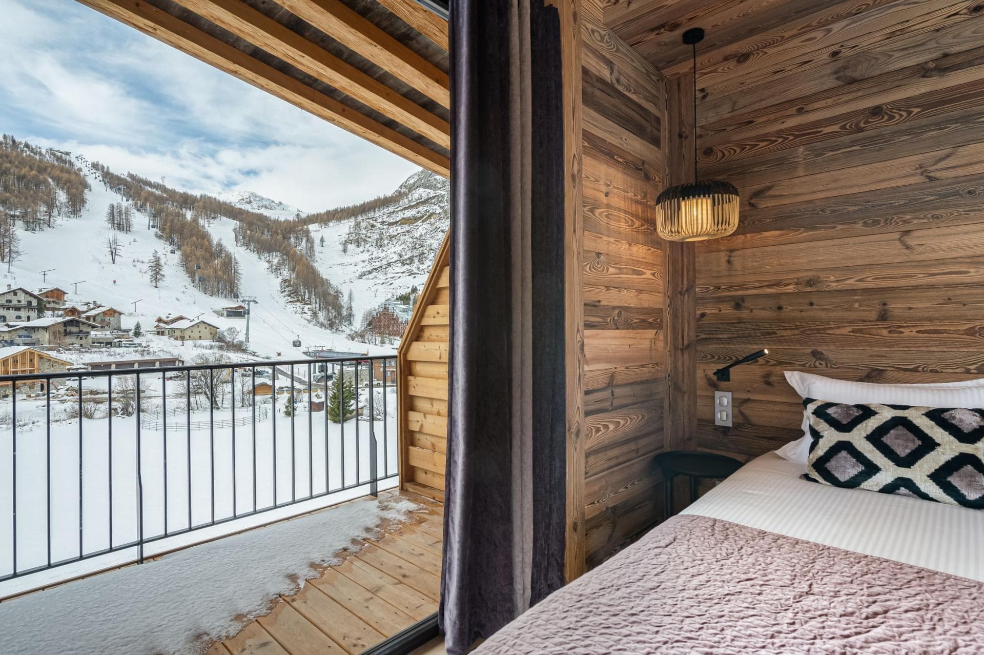 Bedroom with balcony access and views of the ski slopes