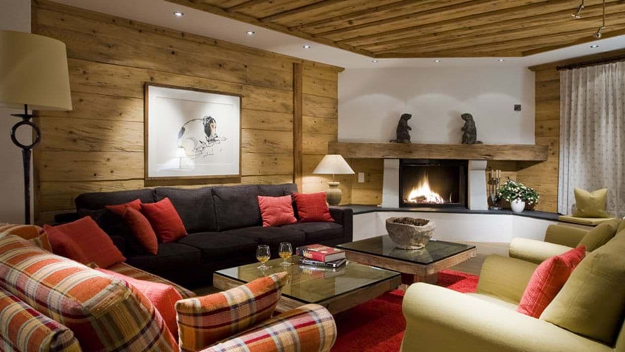 Living area with wood-burning fireplace and seating for 10 guests