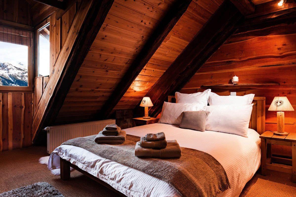 Attic bedroom with queen bed and mountain views
