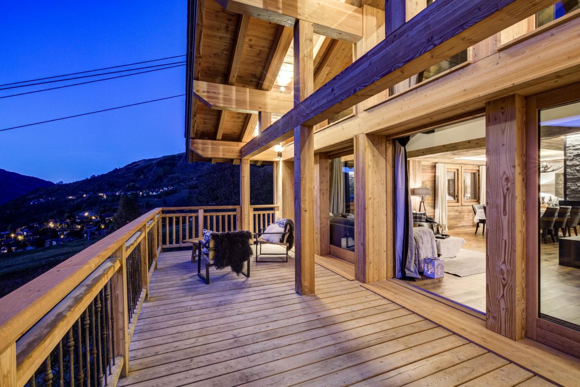 Covered timber deck with lounge seating and valley views