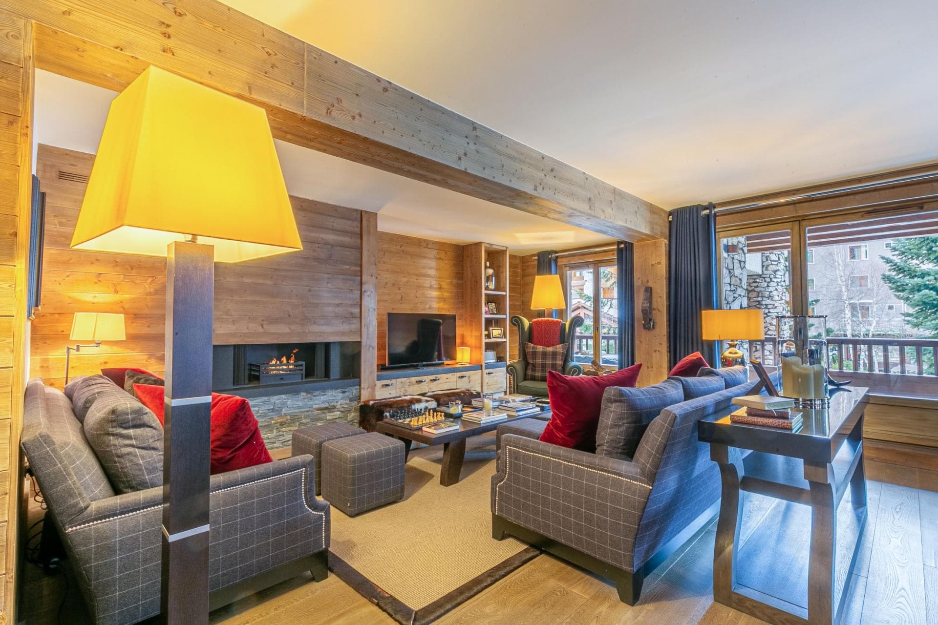 Living room with fireplace and seating for 8; balcony access