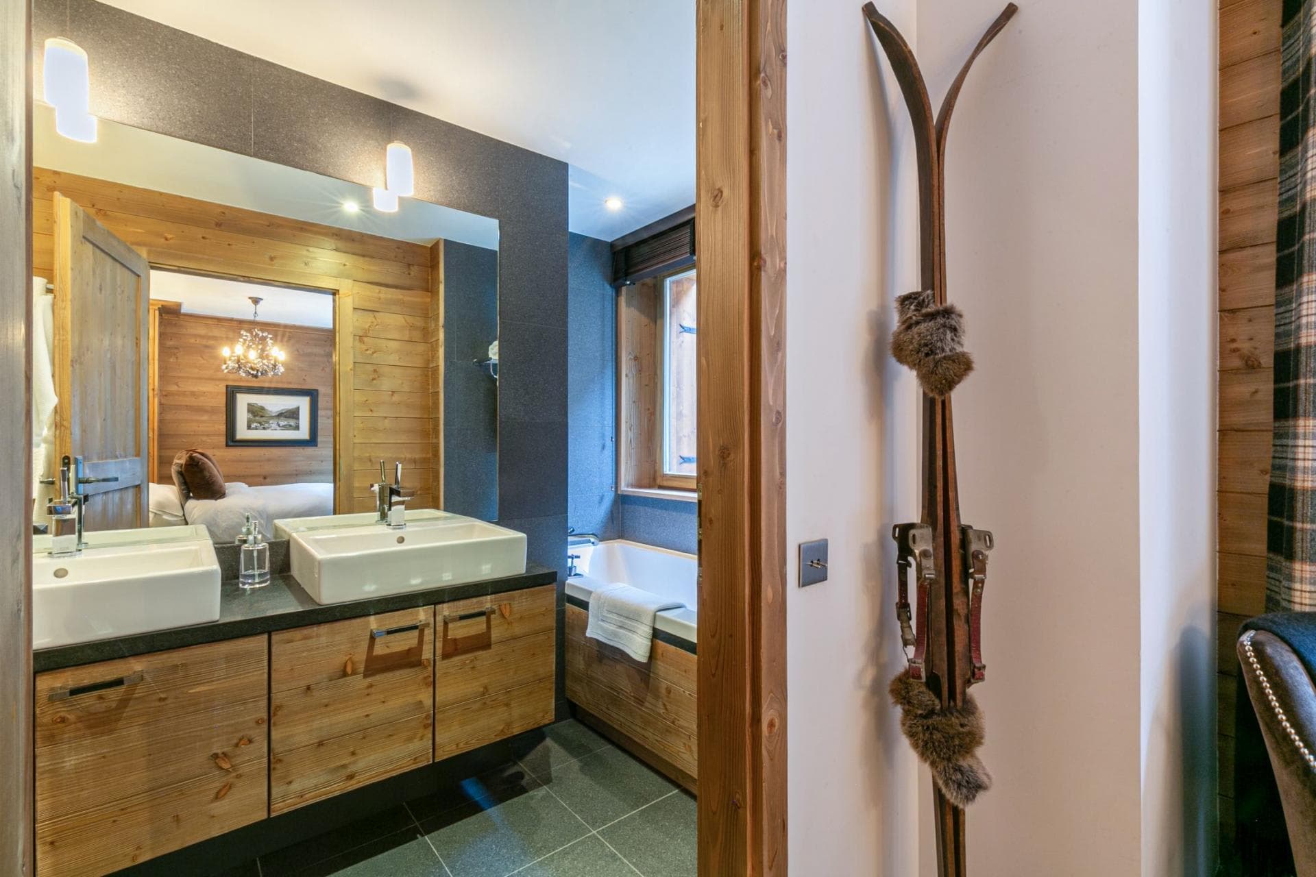 Bathroom with dual vanity and integrated bathtub