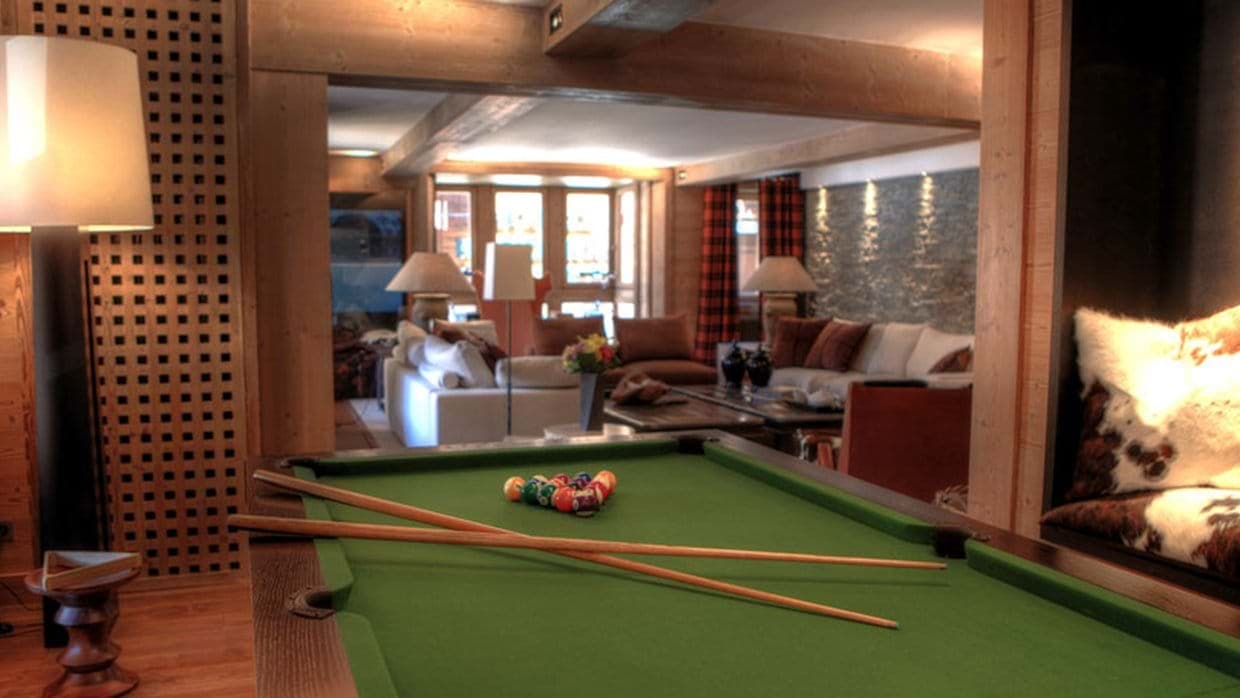 Game room with billiards table and open-plan access to main living area