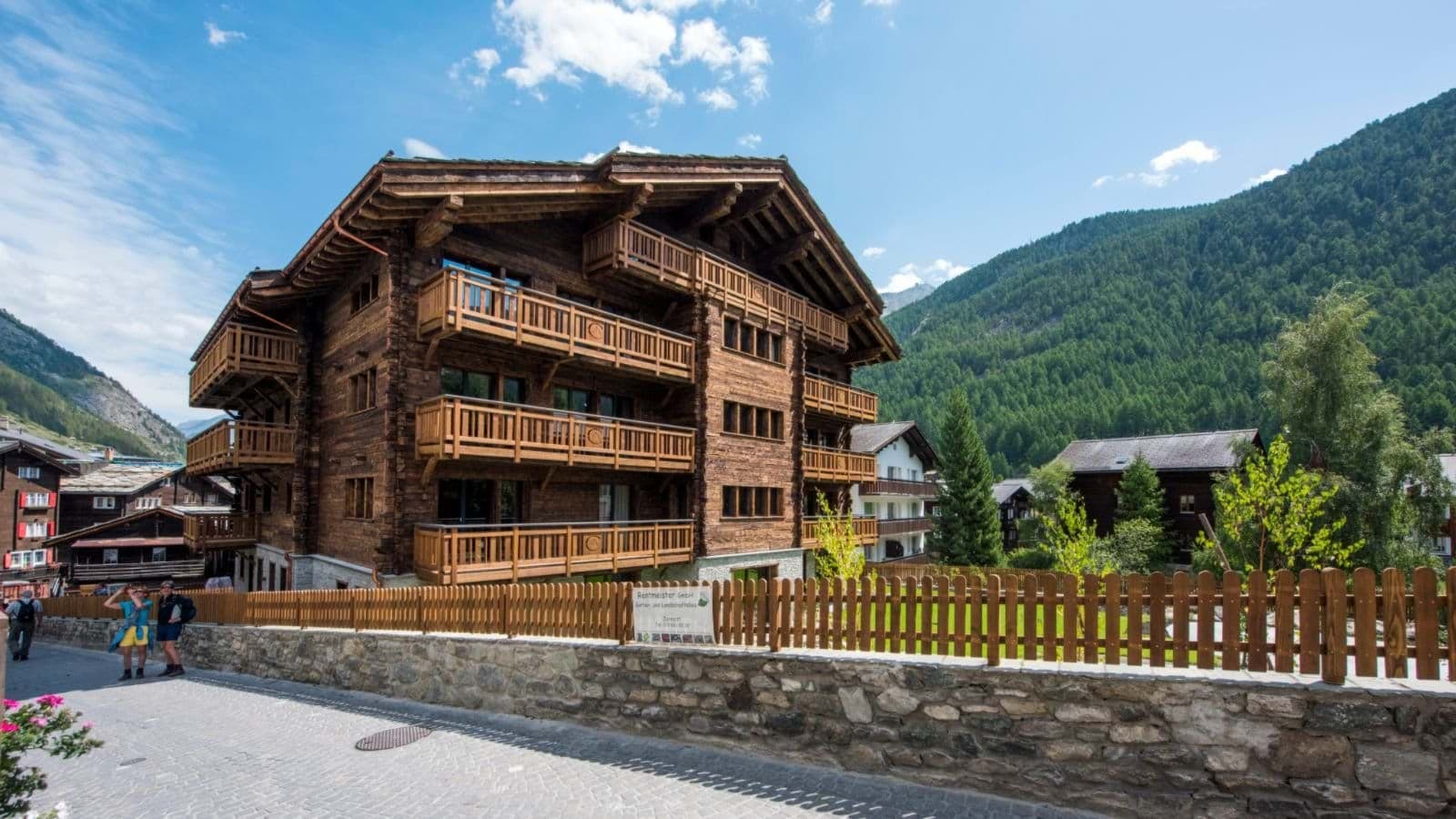 Timber chalet with private balconies and mountain valley views