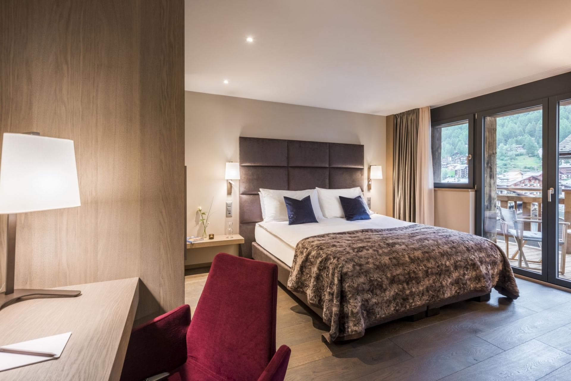 Primary bedroom with king bed and private balcony access