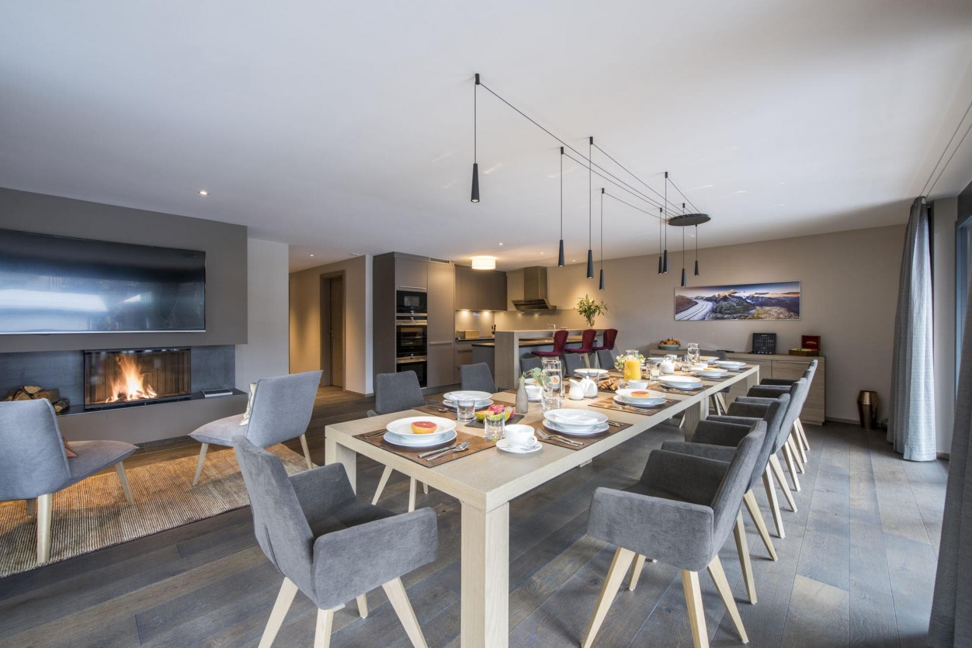 Open dining area seats 12 near gas fireplace and kitchen