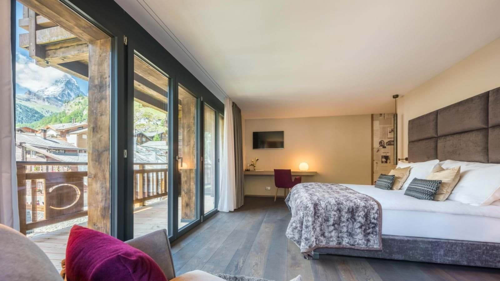 Primary bedroom with Matterhorn views and private balcony access