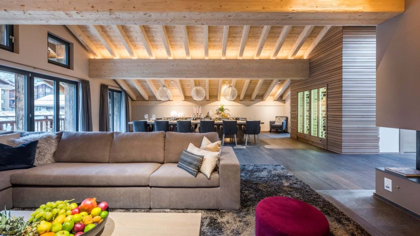 Open-plan living area with 10-seat dining table and wine display cabinet