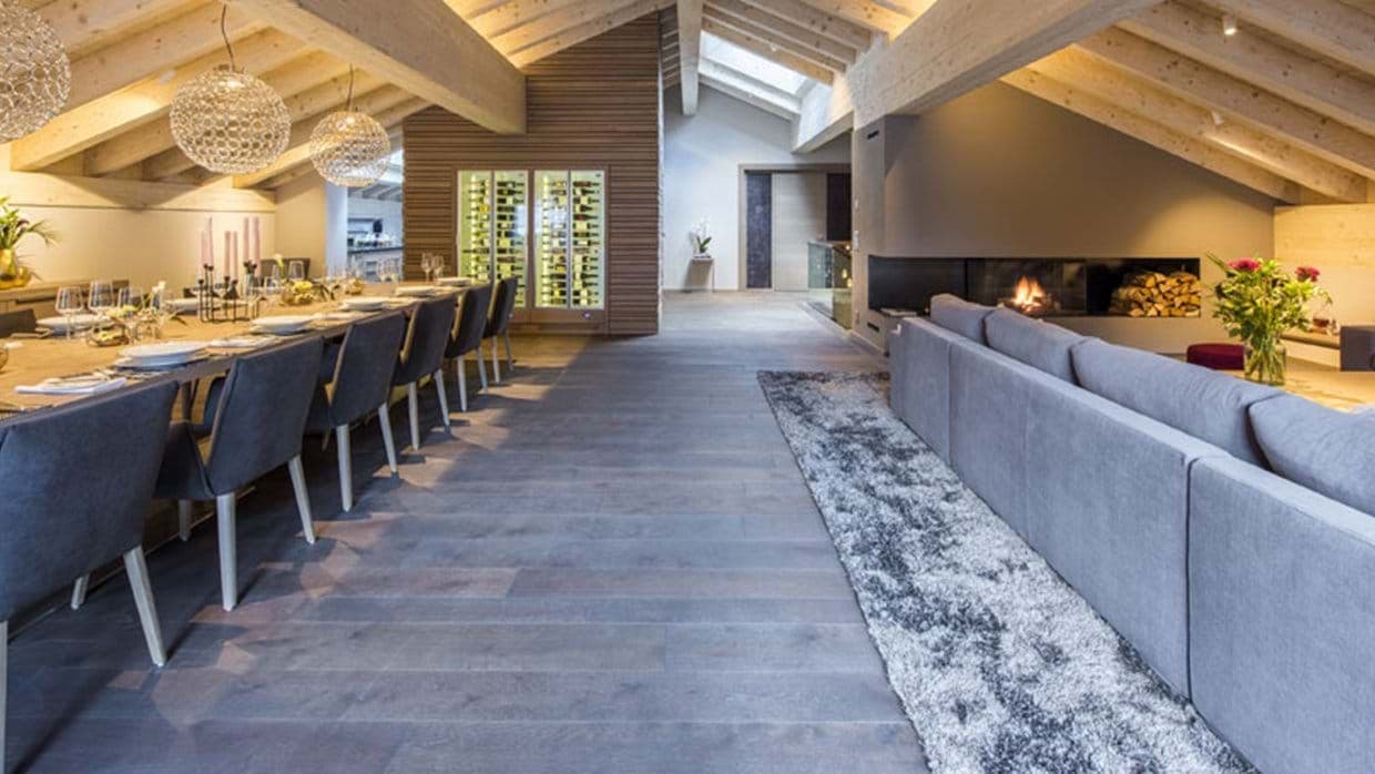 Open-plan living and dining; linear fireplace, seating for 10+, exposed beams