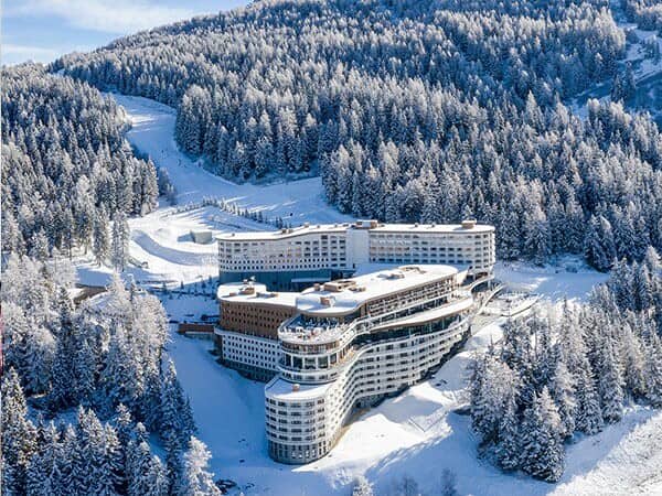 Ski-in/ski-out resort exterior with direct access to groomed mountain runs