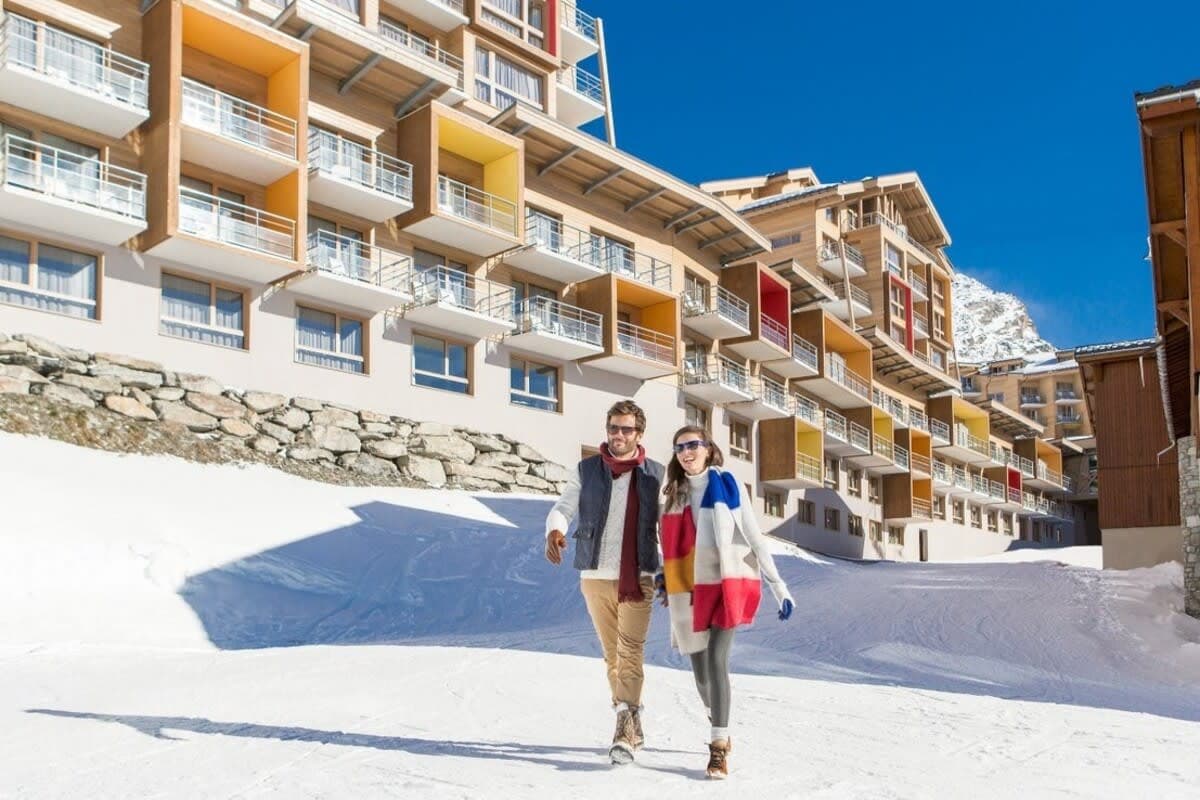 Ski-in/ski-out resort exterior with private balconies and direct mountain access