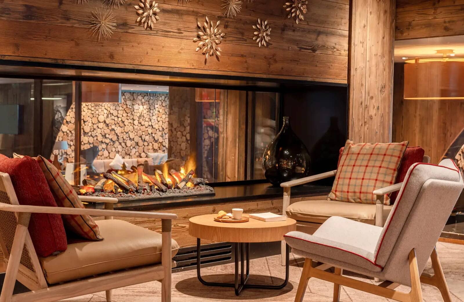 Lounge area with double-sided gas fireplace and wood-paneled walls