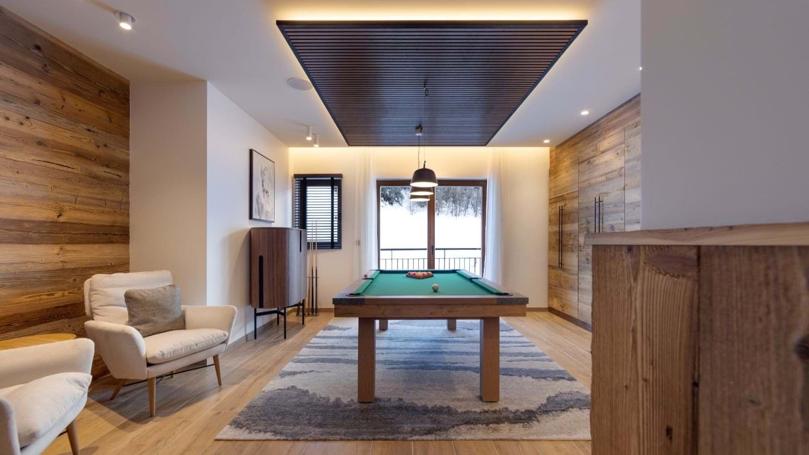 Game room with pool table and balcony access to mountain views