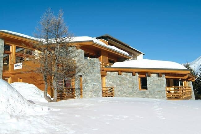Ski-in ski-out chalet with stone exterior and private balconies
