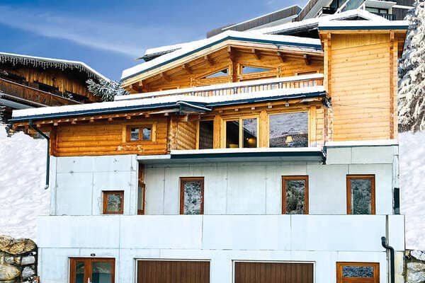 Ski-in/ski-out timber chalet with private garage and balcony