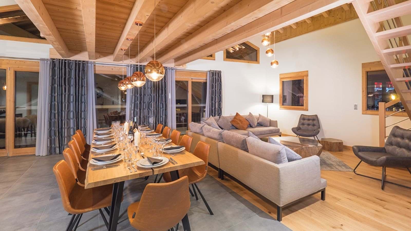 Open-plan living area with dining for 10 and vaulted timber ceilings