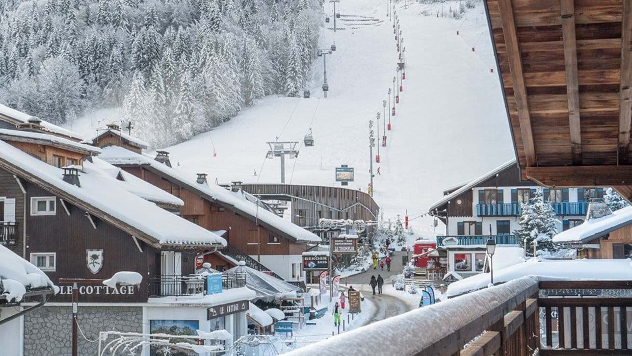 Private balcony view of ski slopes and Pleney cable car