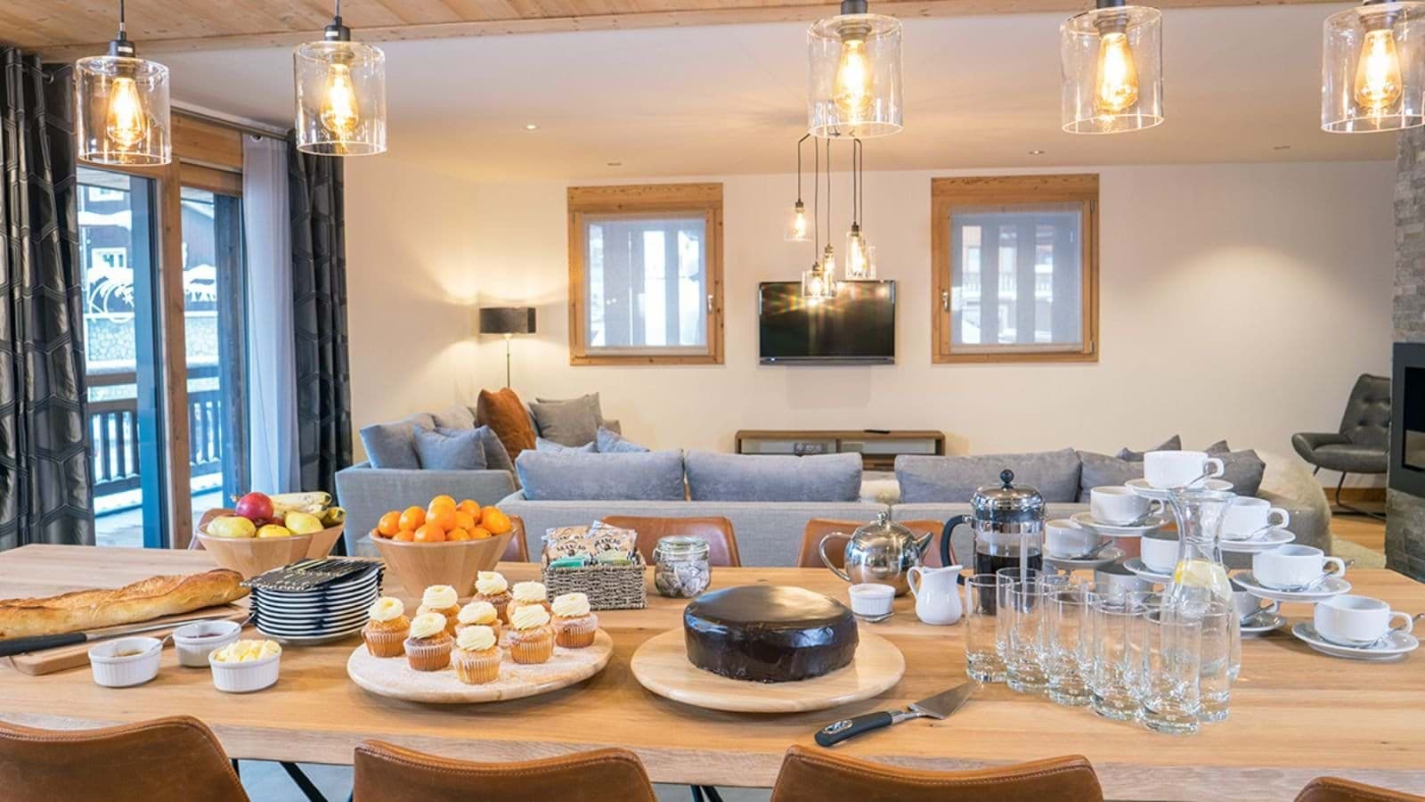 Open-plan dining and living area with sectional seating and balcony access