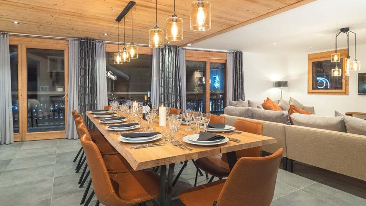 Dining table with seating for 12 and balcony access