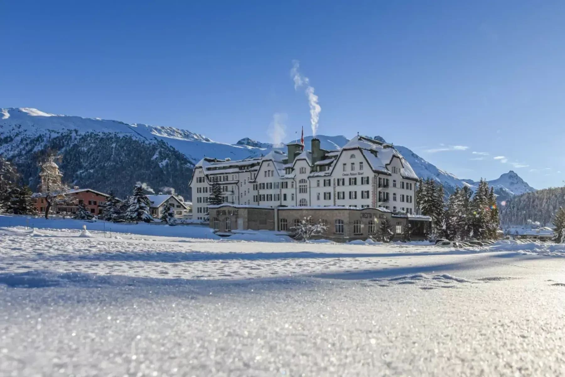 Cresta Palace Hotel exterior with snow-covered mountain backdrop
