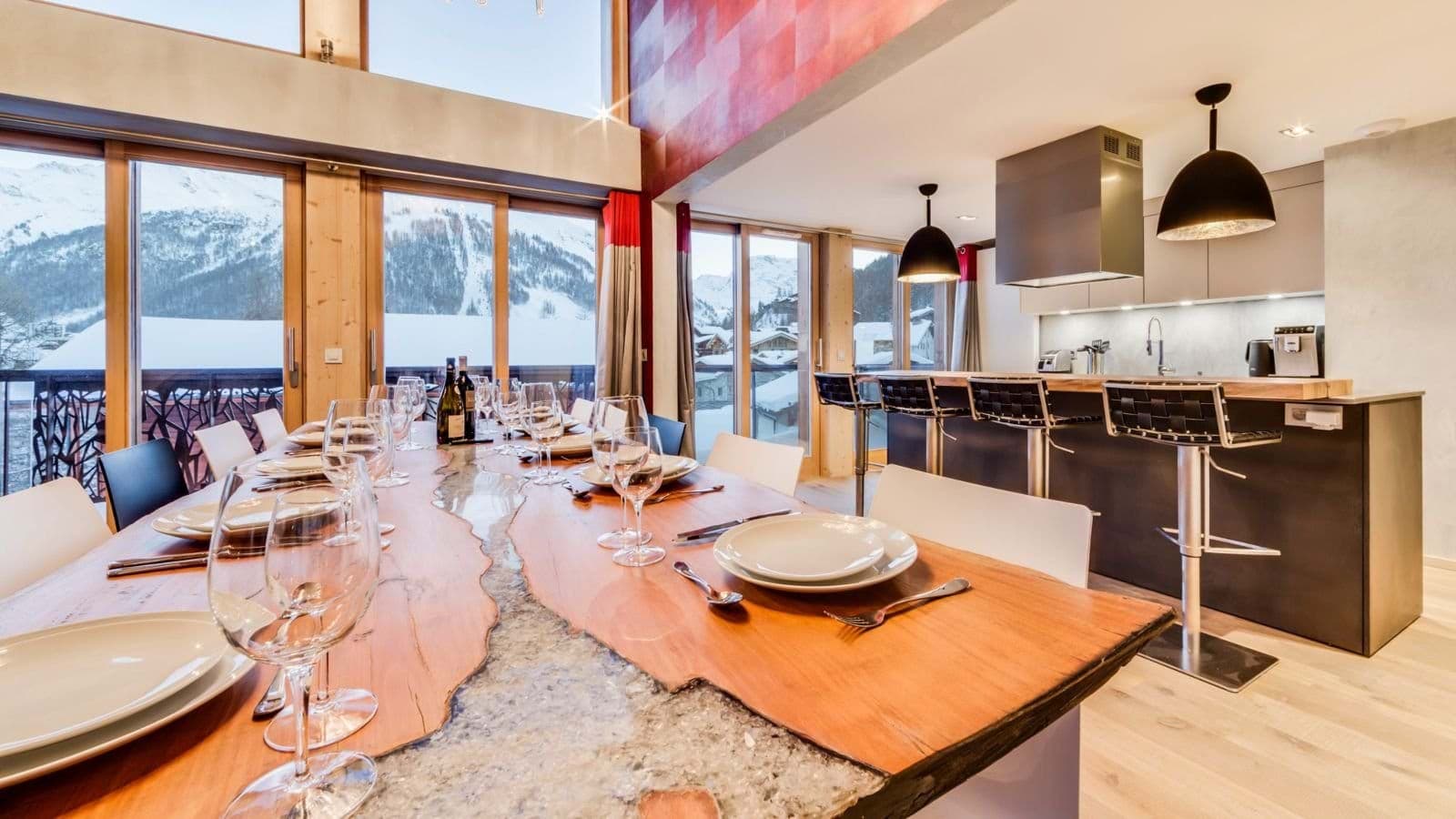 Dining table seats 10 and breakfast bar for 4 with mountain views