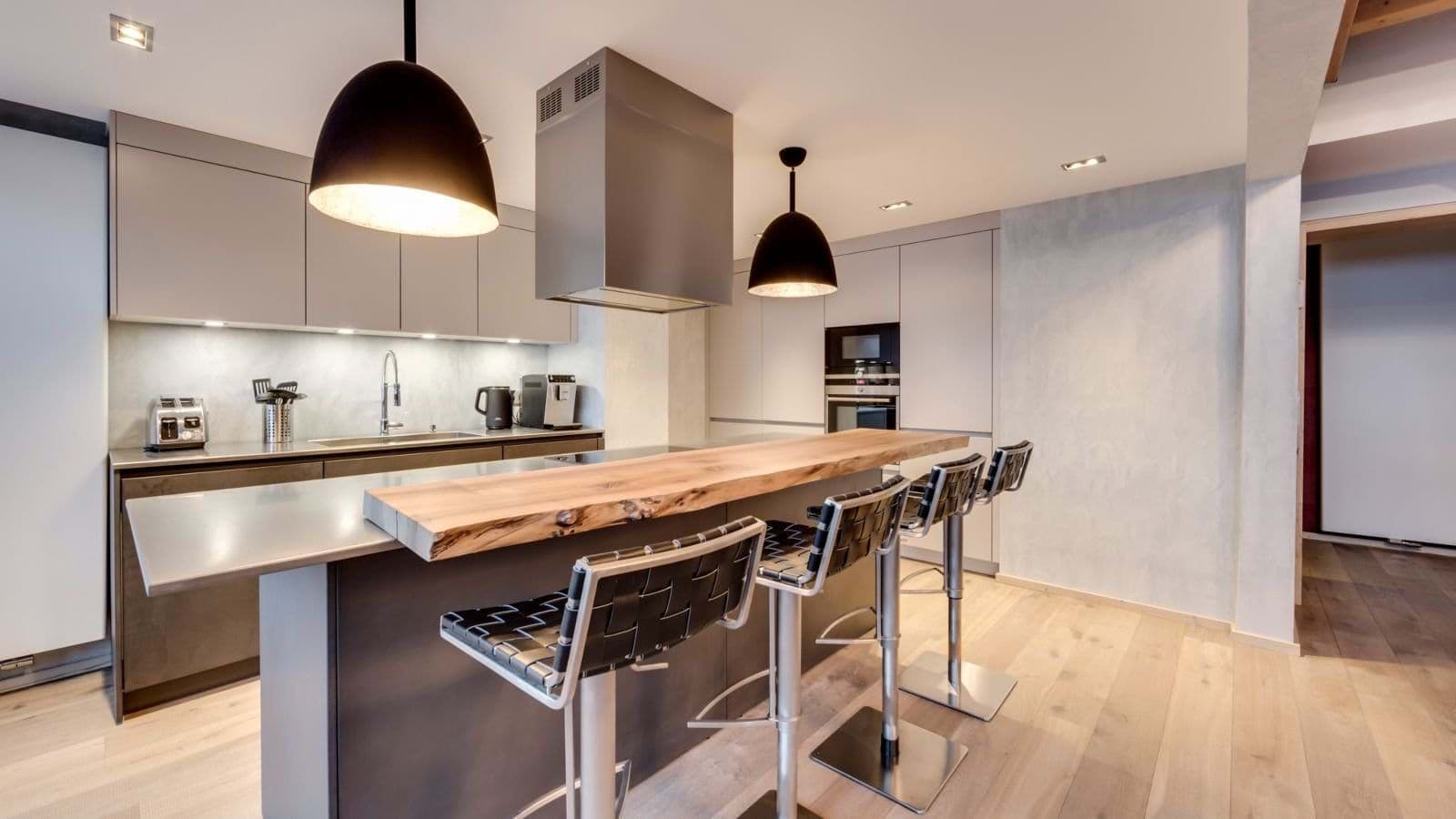 Kitchen island with live-edge wood breakfast bar and seating for 4