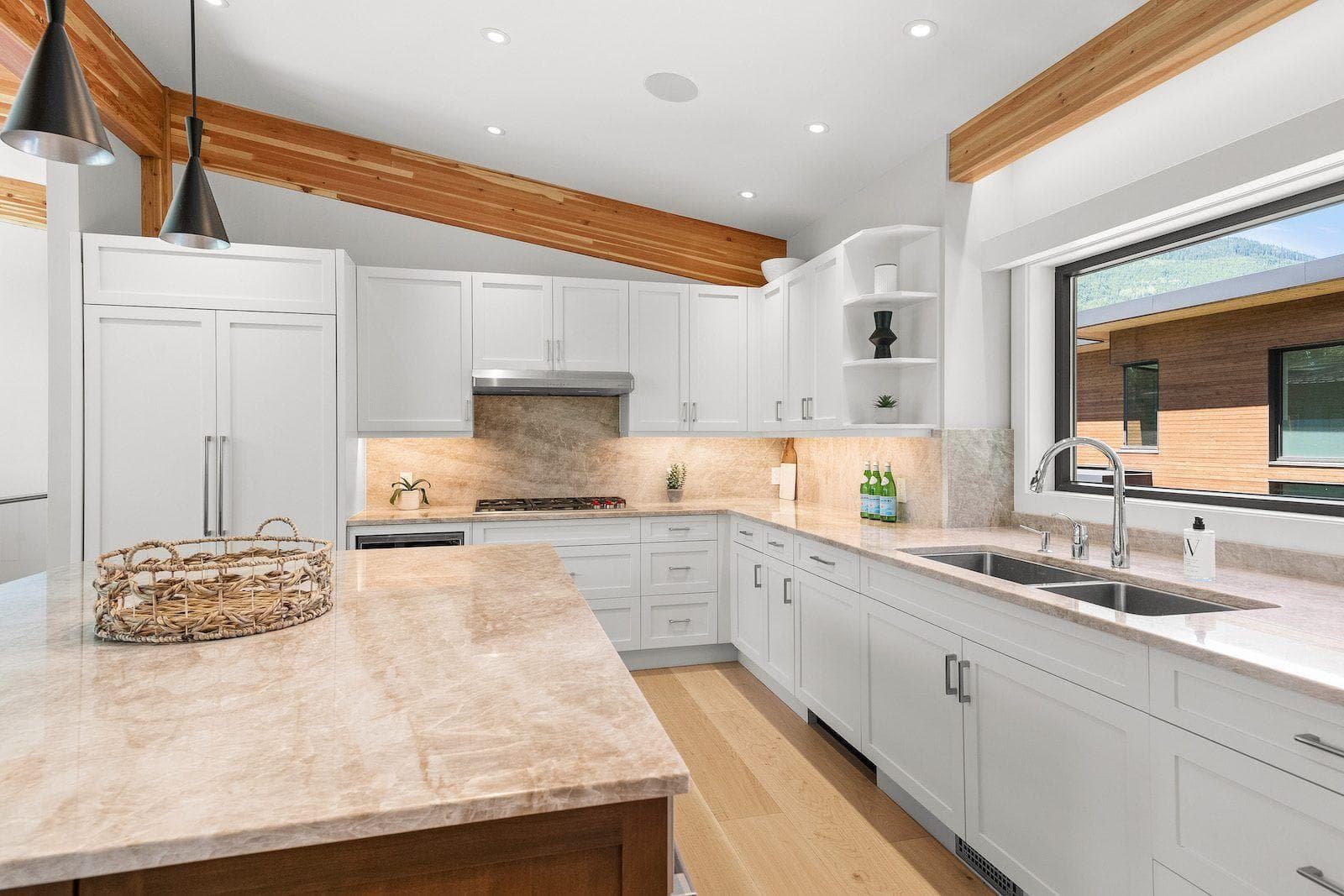 Kitchen with gas cooktop and large stone island