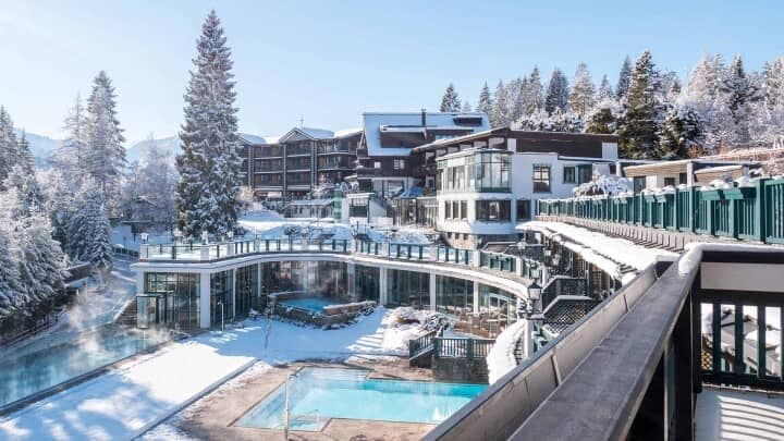 Heated outdoor pools and hot tub with forest mountain views