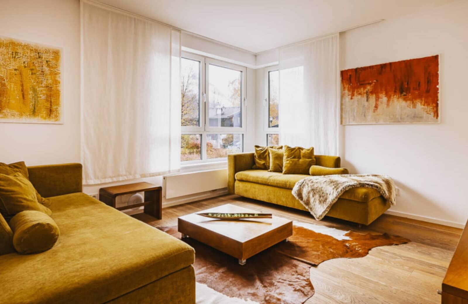 Living area with sofa beds and floor-to-ceiling windows
